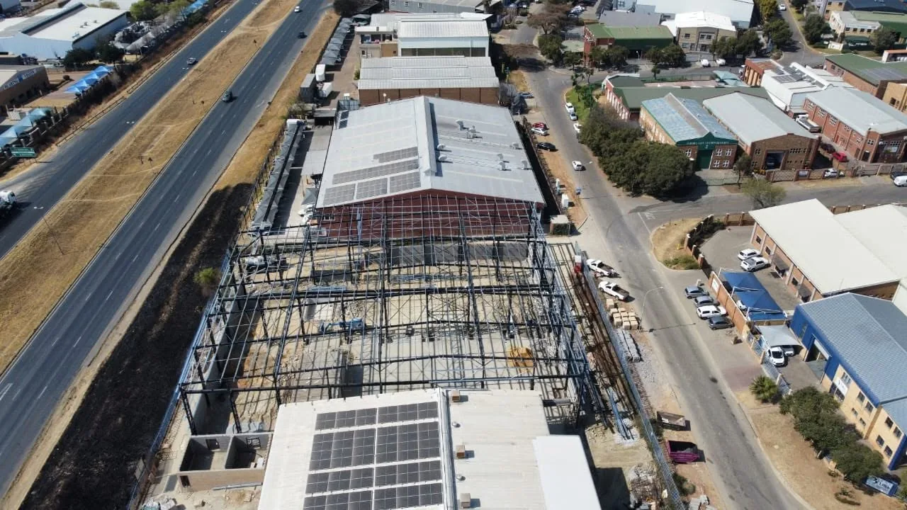 Aerial photograph of a steel-frame structure under construction